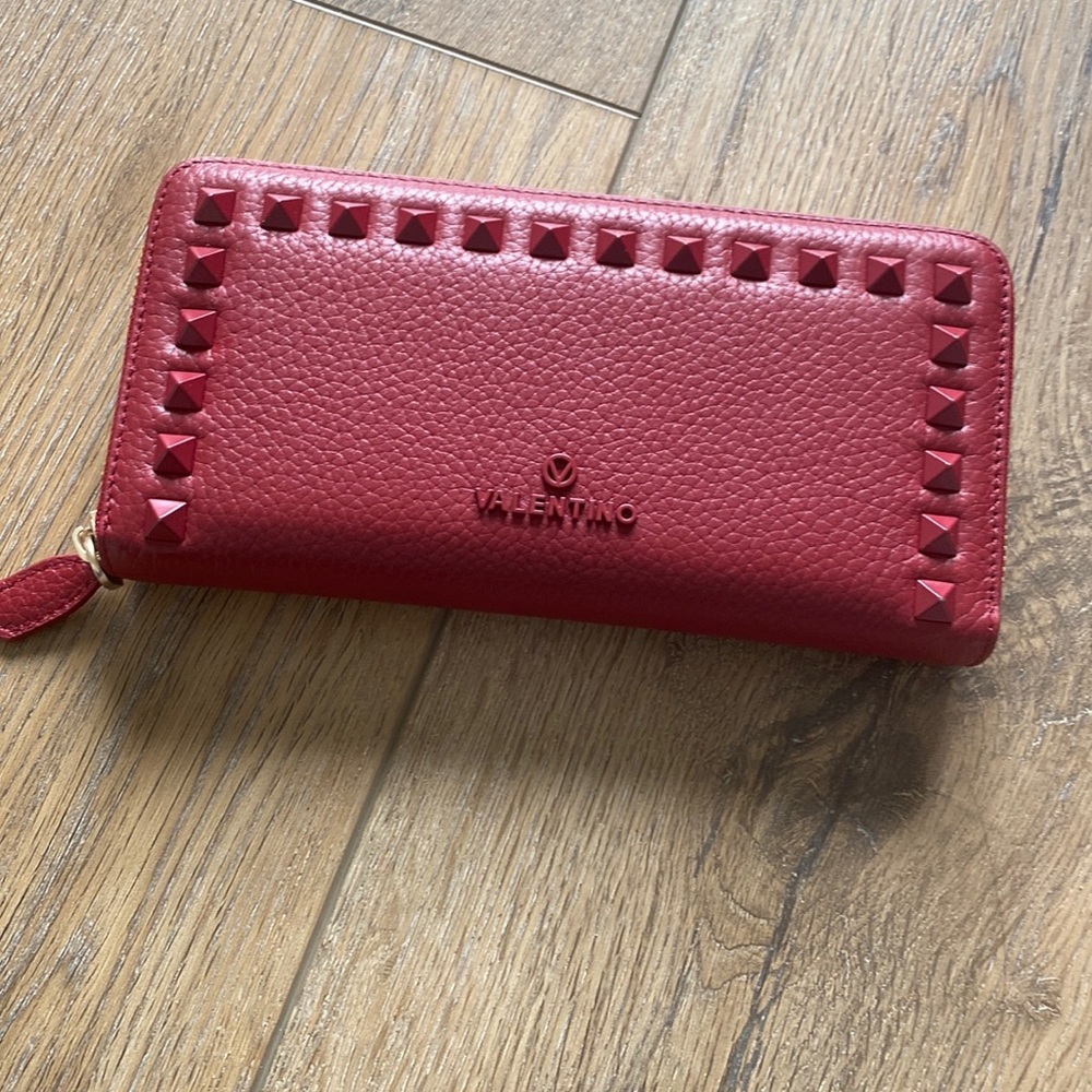 Beautiful, red color woman, brand is Valentino new or without a tag